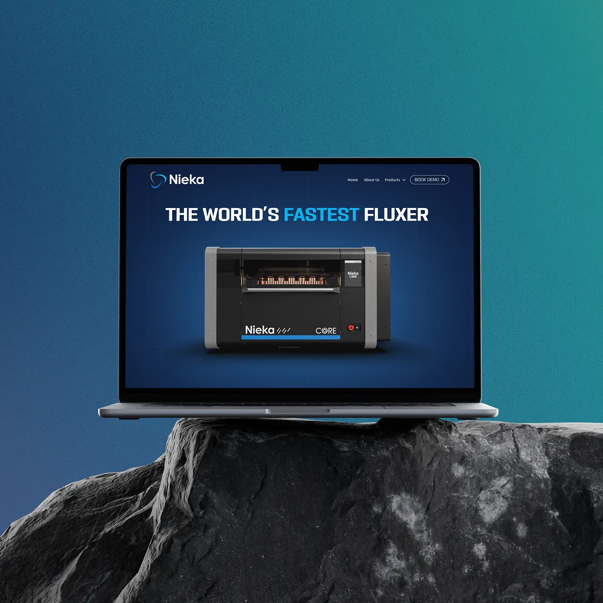 Laptop on a rock displaying an advertisement for Nieka, promoting 'The World's Fastest Fluxer' with an image of the Nieka Core machine.